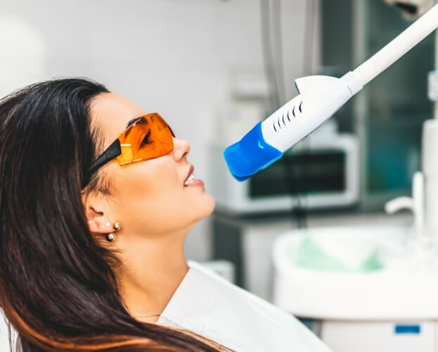 Dental patient receiving in office teeth whitening
