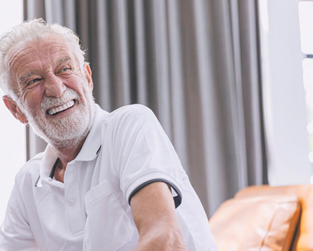 man smiling with dentures