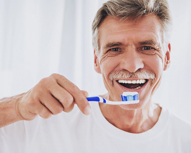 man holding a toothbrush