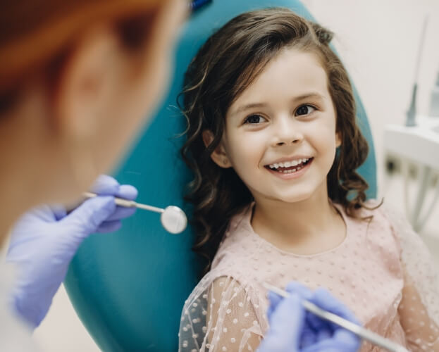 Child smiling at dentist