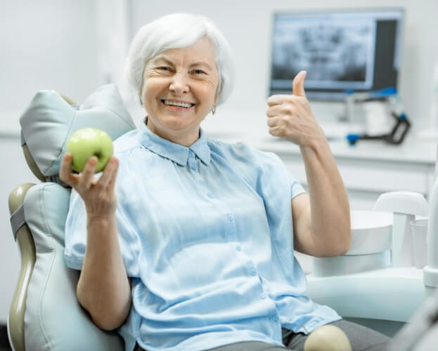 Woman enjoying the benefits of dental implants