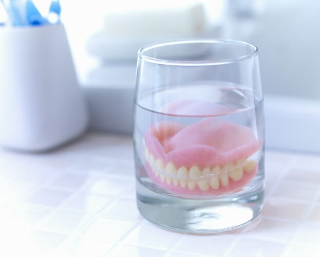 Denture in a glass of water