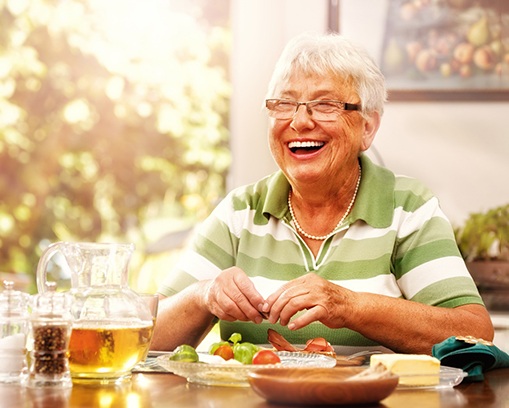 Senior woman with dentures laughing