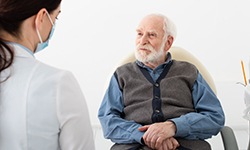 Senior patient listening to dentist