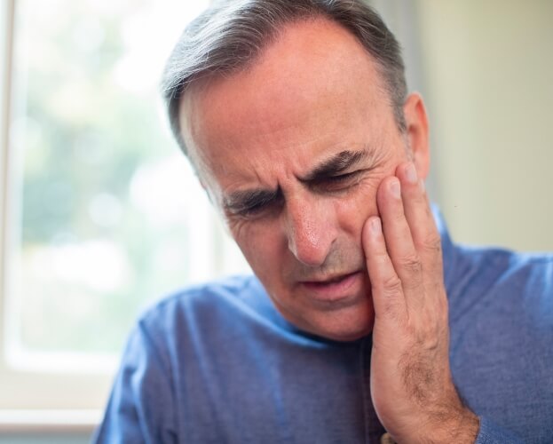 Man in pain before dental emergency treatment