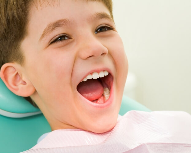 Child laughing during healthy start treatment visit