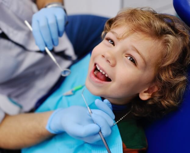 Child smiling during healthy start treatment visit