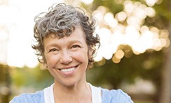 woman smiling after getting dental implants in Casper 