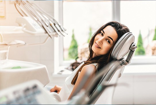 Smiling woman in dental chair