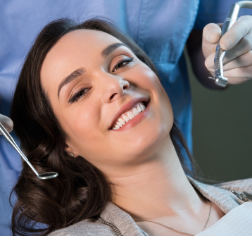 Woman smiling during preventive dentistry visit