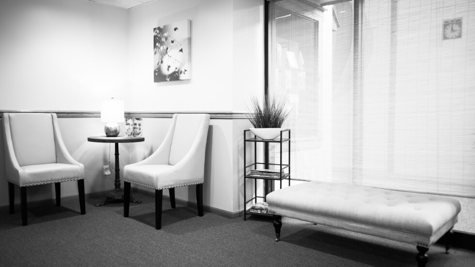 Black and white picture of dental office reception area