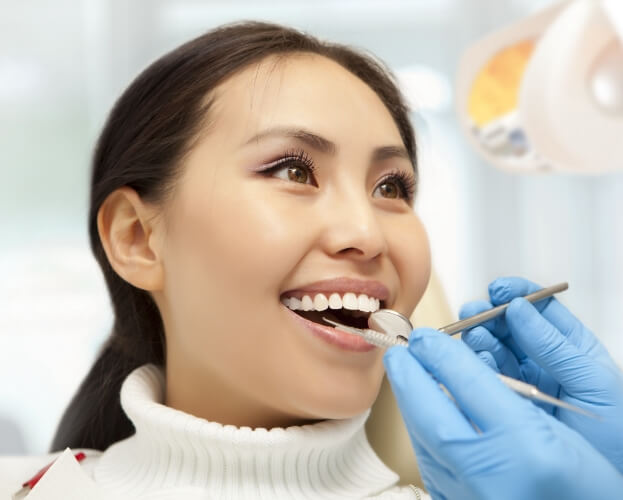 Woman receiving gum disease treatment