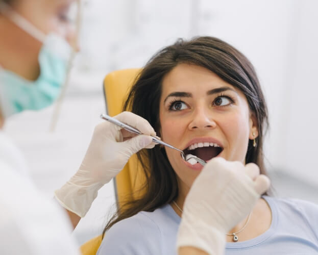 Dental patient receiving oral cancer screening