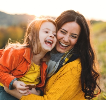 Mother with smiling child after children's dentistry visit