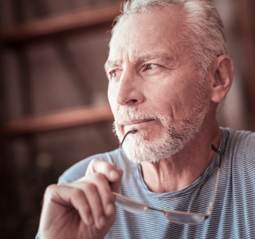 Man considering emergency dentistry