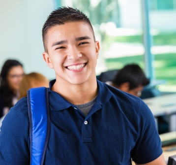 Young man with healthy smile after wisdom tooth extractions