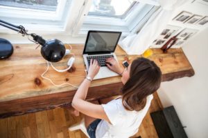 A woman on her computer.