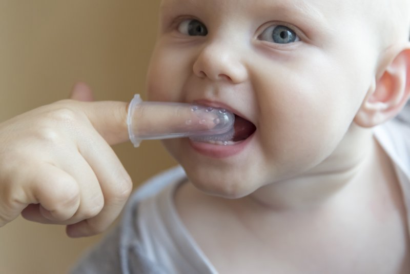 Brushing a baby’s teeth