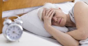 Senior woman with morning headache, may have sleep apnea