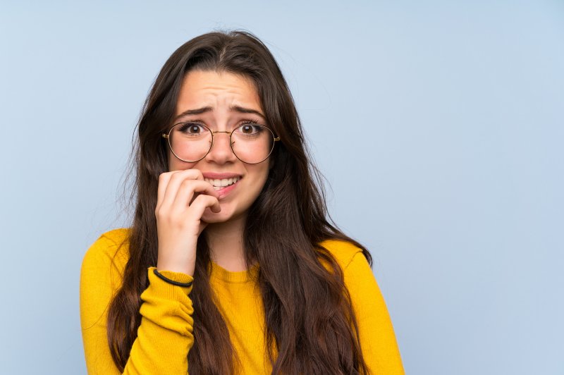 young woman looking scared