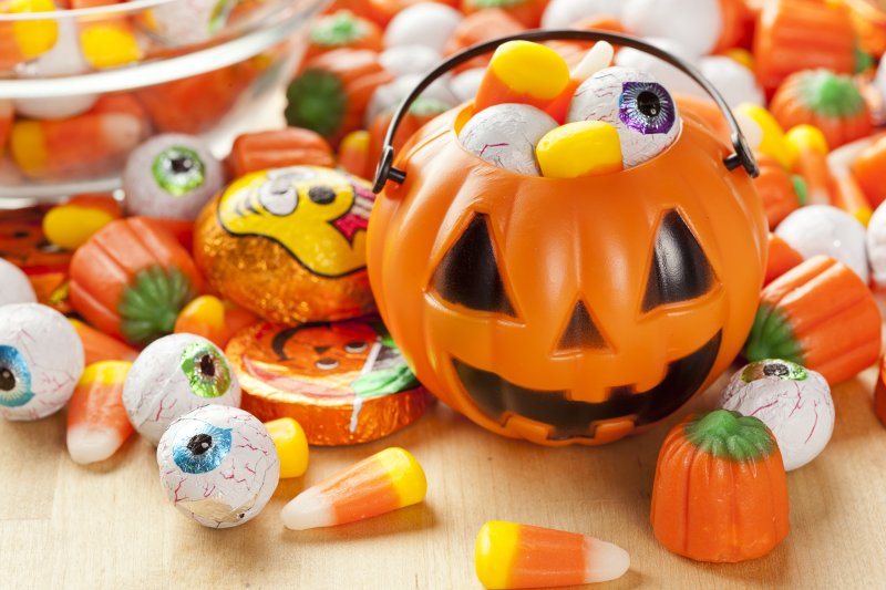 Halloween candy pouring out of bucket