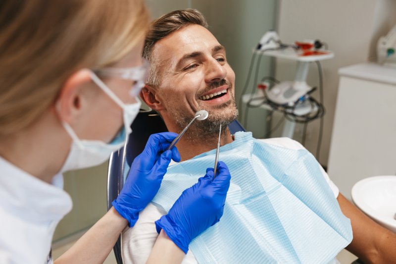 man smiling during dental checkup