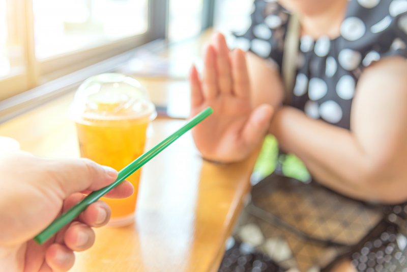 Woman rejecting straw