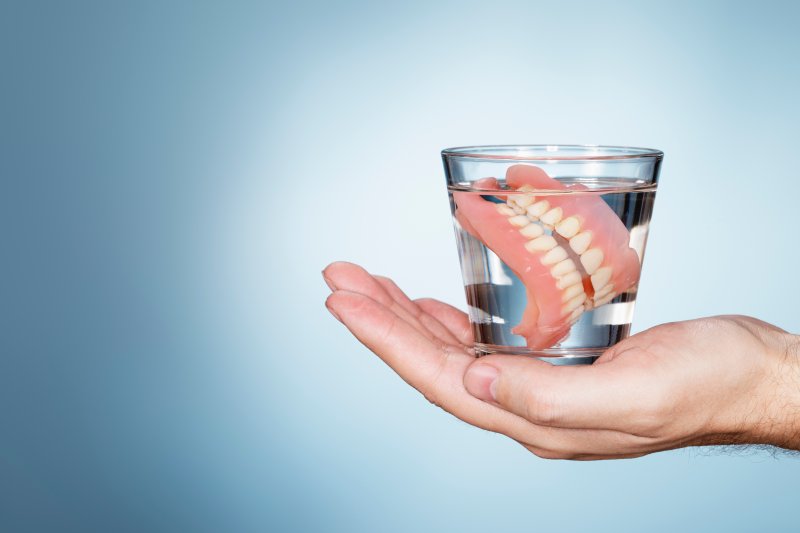 A pair of dentures soaking