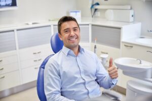 Man smiling after dental implant placement